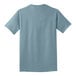 A back view of a Port & Company stonewashed light blue t-shirt.