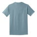 A back view of a light blue Port & Company T-shirt.