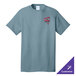 A stonewashed blue Port & Company T-shirt with a red and white logo on it.