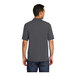 A man wearing a Port & Company charcoal grey polo shirt.