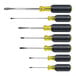 A group of six Klein Tools screwdrivers with yellow handles.