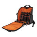 A black and orange Klein Tools backpack with tools inside.