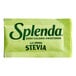 A close up of a Splenda Stevia packet with a green label.