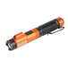 A close-up of a black and orange Klein Tools rechargeable flashlight.