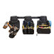 A Klein Tools Tradesman Pro Modular Click-Lock Wall Rack with a tool bag and tool belt hanging from it.