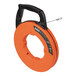 A close-up of a Klein Tools steel fish tape with an orange case and black handle.
