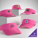 A collection of customizable neon pink visors displayed on white blocks.