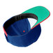 A blue and green 6-panel baseball cap with a red brim.