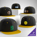 A collection of customizable black and gold 6-panel flat bill snapback caps with various logo designs on the front.