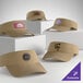 A collection of customizable khaki visors displayed on white blocks.