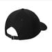 A black Port & Company dad cap with a white background.