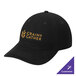 A black Port & Company dad cap with gold text that says "grain gather" on a table.
