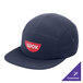 A navy blue Port Authority camper cap with a logo on it.