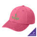 A bright pink Port Authority dad cap with green text that says "Forge" on the front.