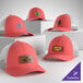 A group of customizable coral and white 6-panel trucker caps with mesh backs, displayed on white platforms.
