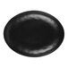 A black oval melamine plate with a shiny surface.