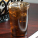 a glass of ice tea with ice