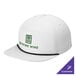 A white Port Authority camper cap with black rope detail and green text that reads "Divine Wine"