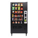 A Selectivend snack vending machine with snacks on shelves.