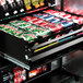 A VEND MACH 29 SLT COMBO CC 35X31X75 vending machine filled with a variety of soda cans.