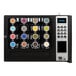 A black vending machine with colorful circles on the front.