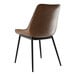 A brown tufted vinyl Lancaster Table & Seating chair with black legs.