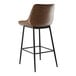 A brown leather Lancaster Table & Seating Mid-Century bar stool with black legs.