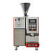 An Astra Super Mega red automatic coffee machine with a screen and a door.