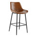 A Lancaster Table & Seating black metal bar stool with a cognac tufted vinyl seat.