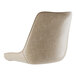 A Lancaster Table & Seating beige vinyl tufted chair cushion on a chair with a backrest.