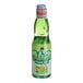 A close up of a Hana Ramune Melon Soda bottle filled with green liquid.