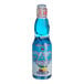 A close up of a Hana Ramune Blue Hawaii soda bottle with a label.