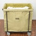 A Lavex large white canvas liner inside a metal frame laundry cart.