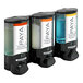 A black wall-mounted soap dispenser with three translucent bottles and a Paya logo.