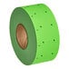 A roll of DayMark fluorescent green date coder labels with holes on it.