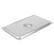A Vollrath stainless steel rectangular deli pan cover over a stainless steel pan.