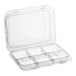 A clear plastic Good Natured macaron and treat package with four compartments.