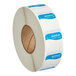 A roll of white labels with blue writing.