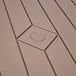 A close up of a brown wood surface on a National Public Seating folding picnic table.