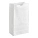 A plain white waxed paper bag standing upright.