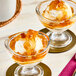 A bowl of ice cream topped with Fanale apple jam.