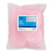 A pink Lavex plastic bag of liquid soap with a blue and white label.