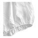 A white queen size cotton and polyester fitted sheet with elastic edges.