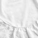 A close up of a white Oxford Micro Superblend king size fitted sheet with ruffles.