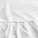 A white Oxford Super Deluxe fitted sheet with red stitching.