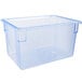 A clear plastic Carlisle food storage box with blue trim.