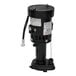 A black Hartell ice machine pump with a white label on a round object.