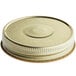 A close up of a 70/450 gold metal lid with a round button and metal rim.