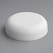 A white round 58/400 continuous thread dome lid on a gray surface.