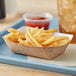 A Southern Champion paper food tray with french fries and a drink.